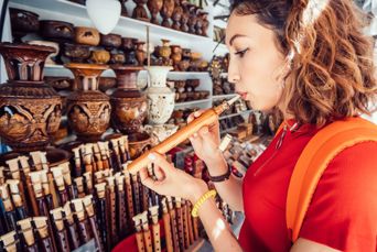 Armenia Yerevan Woman Inspects A Duduk Traditional Armenian Musical Wooden Instrument